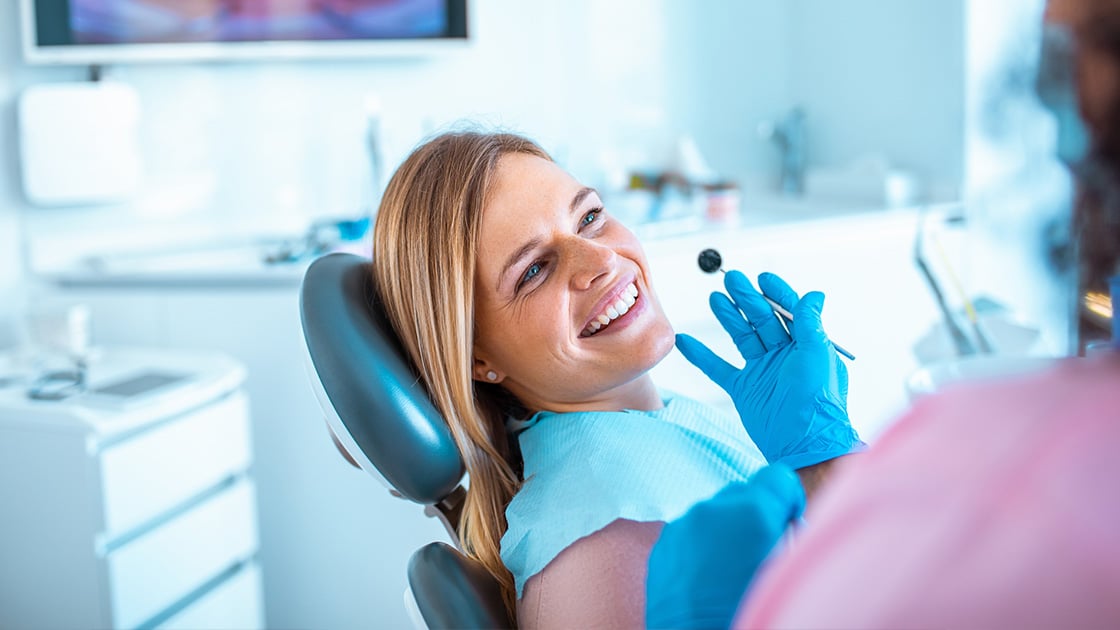 mature woman in dental chair for root canal treatment