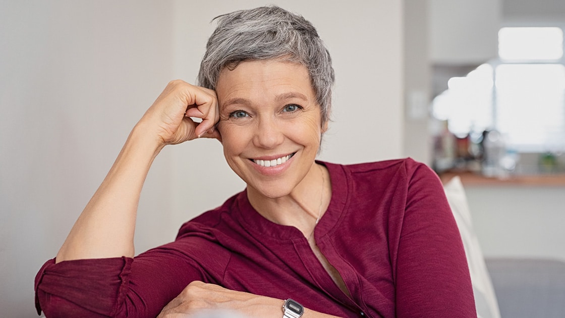 mature woman with dentures smiling
